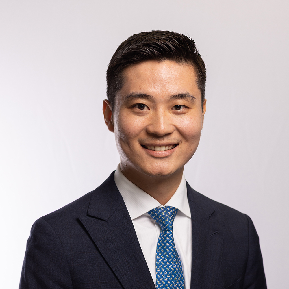 A head shot of MBA alumnus Junzhi