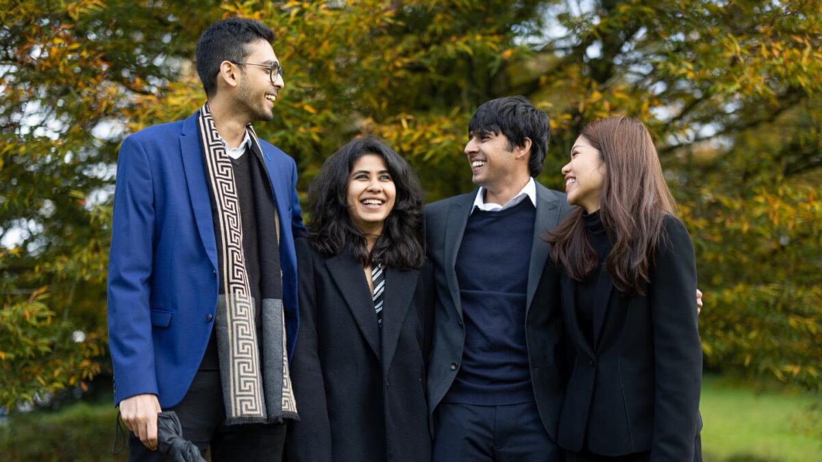 Itishri-standing-second-from-the-left-with-three-fellow-students-in-a-park.