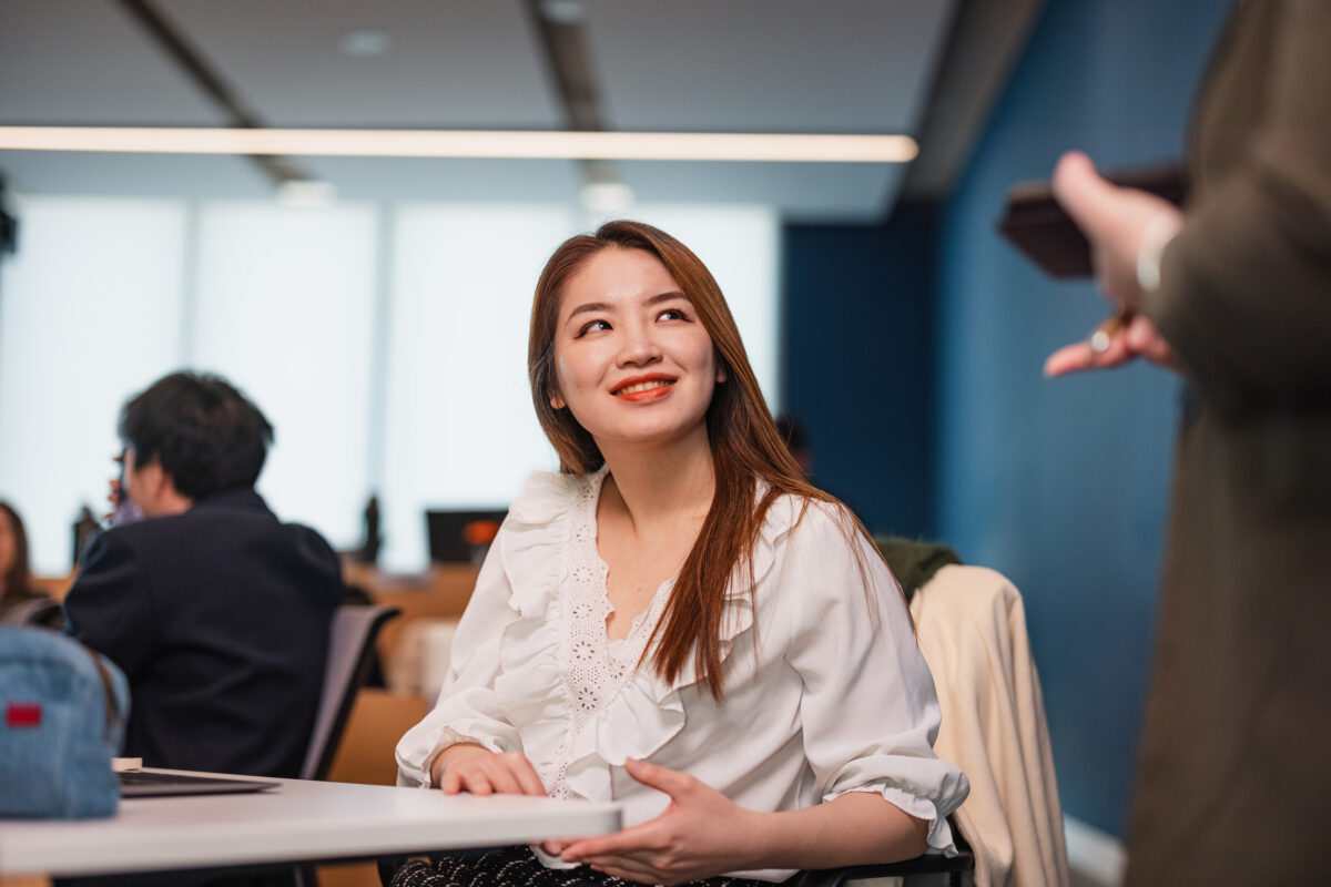An MBA student sitting at a desk